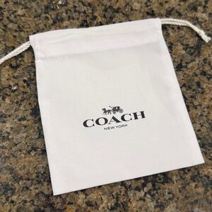 Authentic Coach dust bag. Drawstring jewelry bag. Iconic white and black logo